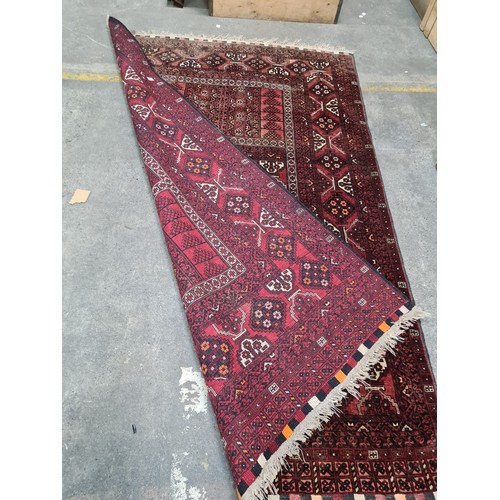 950 - Star lot : A fabulous hand knotted woolen Persian style rug with an intricate geometric pattern in w... 