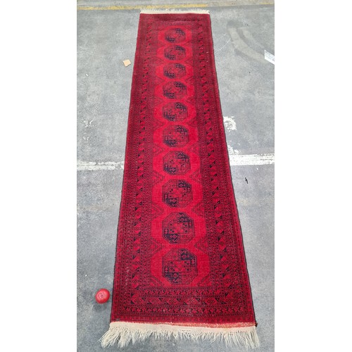 947 - Star Lot : A marvelous hand knotted woolen hall runner featuring an intricate geometric pattern in s... 