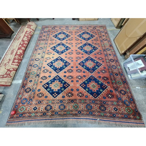 948 - Star lot : An elegant and very large hand knotted 100% woolen rug from Kashgari featuring an intrica... 