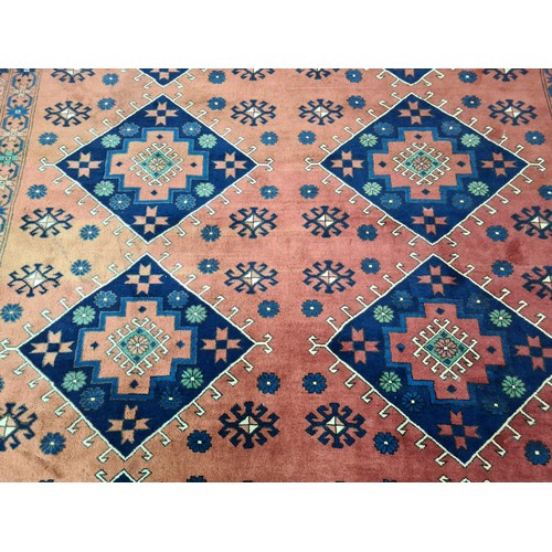 948 - Star lot : An elegant and very large hand knotted 100% woolen rug from Kashgari featuring an intrica... 