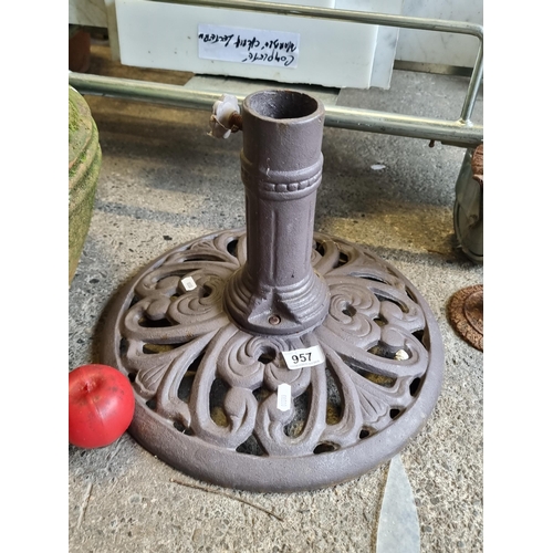 957 - A heavy cast umbrella base.