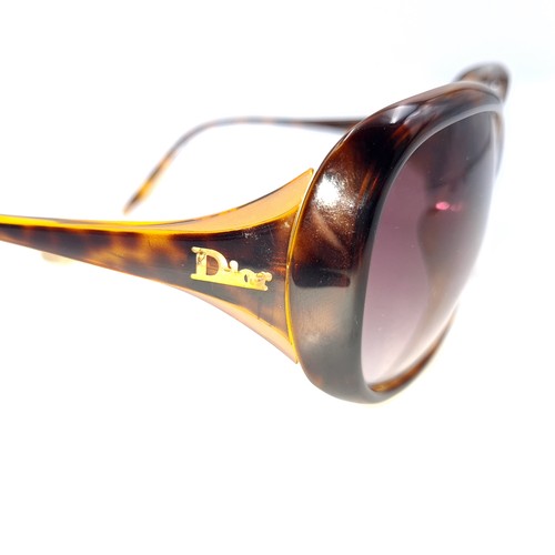 13 - Star Lot : A pair of genuine as new Dior sunglasses in faux turtle shell Ex shop stock. €480 RRP