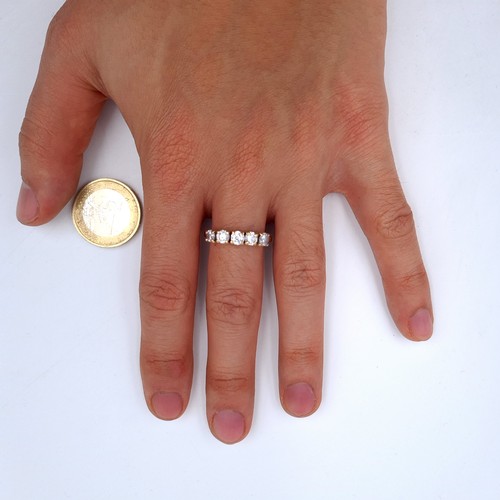 26 - Star Lot : A 9K gold five stone gem set half eternity ring, ring size Q, weight 3.01 grams.