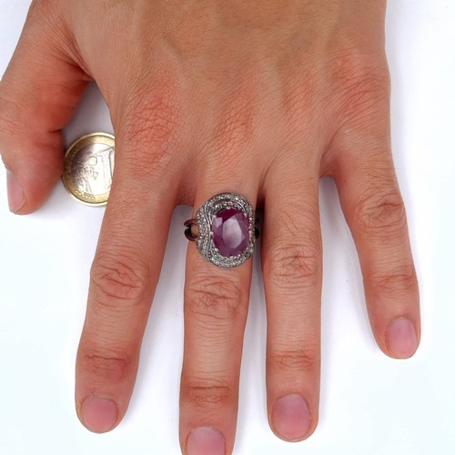 57 - Star Lot : A natural beautiful large ruby and diamond ring, stone is 12.3 ct, weight of ring is 7 gr... 