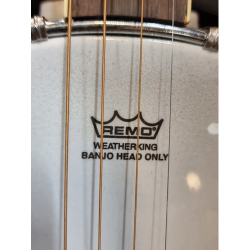 400 - Star Lot: A high quality 4-string 'The Bridge' banjo from Clareen Banjos with a Remo head. With a he... 