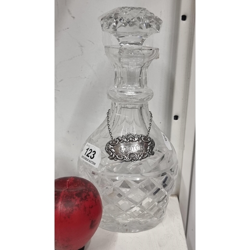 123 - A handsome Waterford Crystal decanter in the Glandore pattern with a sterling silver label boasting ... 