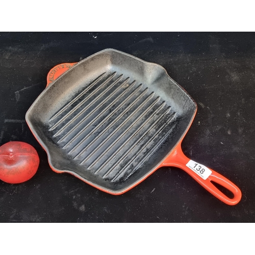 138 - A high quality Le Creuset cast iron grill skillet in a red finish.