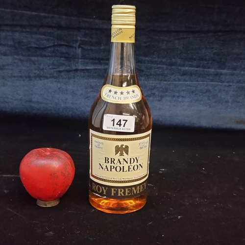 147 - A sealed vintage 667ml bottle of Roy Fremey Brandy Napoleon.