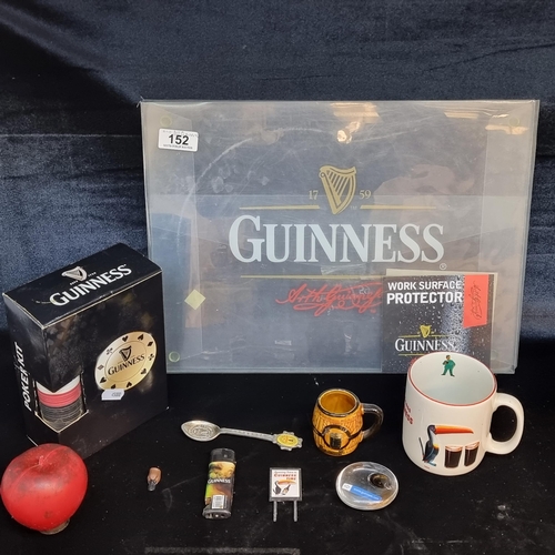 152 - Eight Guinness branded items including a brand new poker kit, an official merchandise mug, a neatly ... 