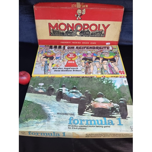 156 - Three board games including vintage Irish Edition Monopoly, vintage Waddington's Formula 1 and a bic... 