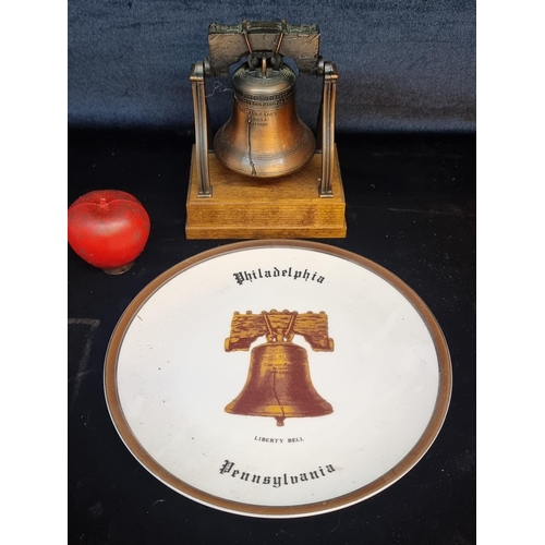 173 - Two Philadelphia Liberty Bell memorabilia items including a neatly sized metal replica of the real e... 