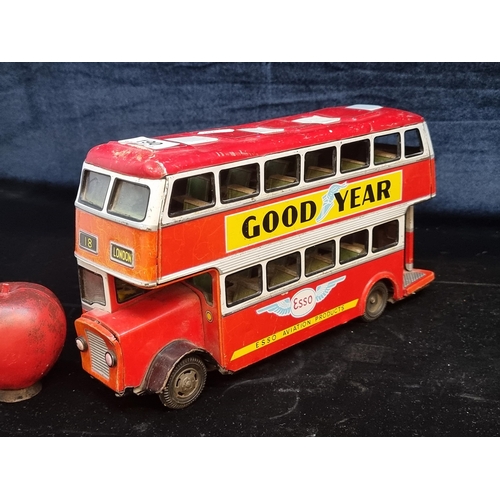 190 - A charming vintage tinplate model double-decker bus from Hayashi advertising Good year, Esso, Dunlop... 