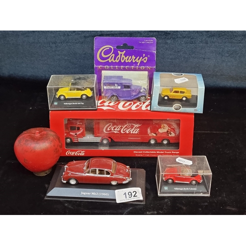 192 - A collection six diecast model vehicles including a large Coca Cola truck, a Jaguar Mk2, a Volkswage... 