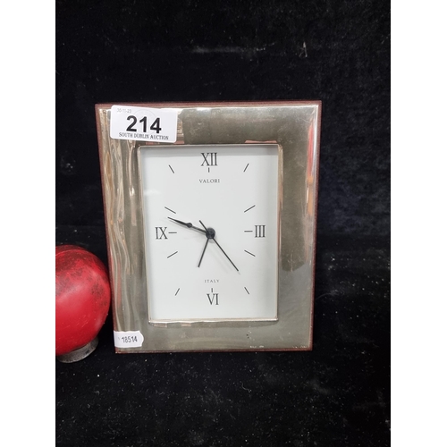 214 - A Valori Italian sterling silver and wood clock with Roman numeral dial.