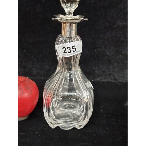 235 - An antique exquisite cut glass decanter with Sterling Silver collar and original stopper. In very go... 