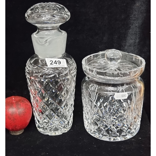 249 - Two stylish cut crystal items including a large Waterford crystal lidded biscuit barrel and a tall d... 