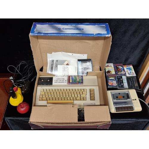 262 - Star Lot : A classic Commodore C64 keyboard as well as a 15539 Datassette Unit. Along with a large s... 