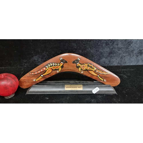 267 - A wonderful hand crafted hardwood Australian boomerang with display stand.