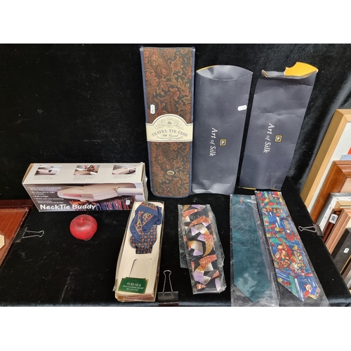 268 - A mixed lot of gentleman's items including a motorized Neck Tie Buddy, a travel tie case and a selec... 