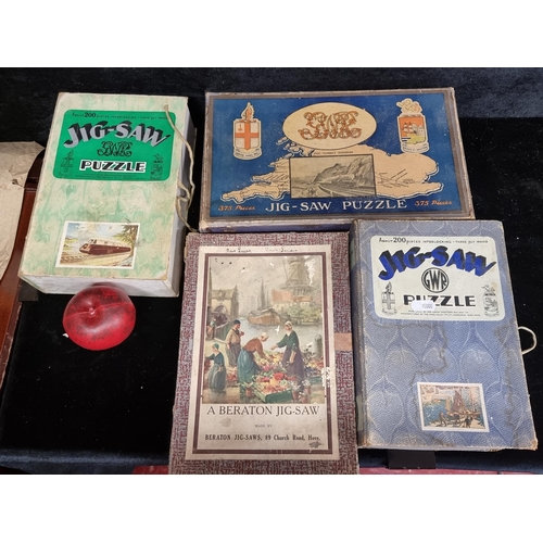 274 - A collection of four rare vintage 1930s-1950s jig-saw puzzles.