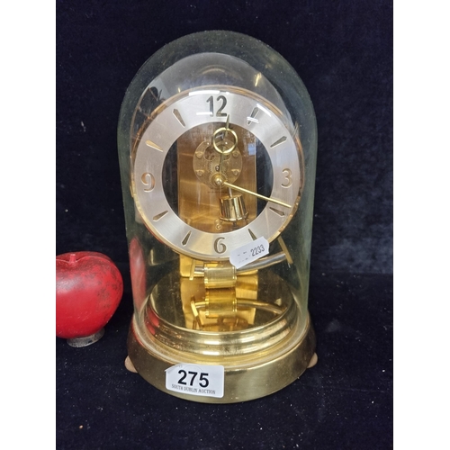 275 - A beautiful rare Kundo anniversary clock with glass dome and mechanical mechanism. In very nice cond... 