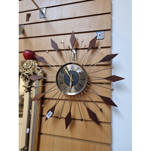 301 - A gorgeous mid century modern German made wall clock with brass face and hands, set in a wood and br... 