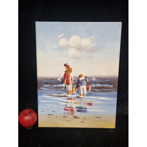 62 - A charming oil on canvas painting featuring a seaside scene of two young children paddling in the la... 