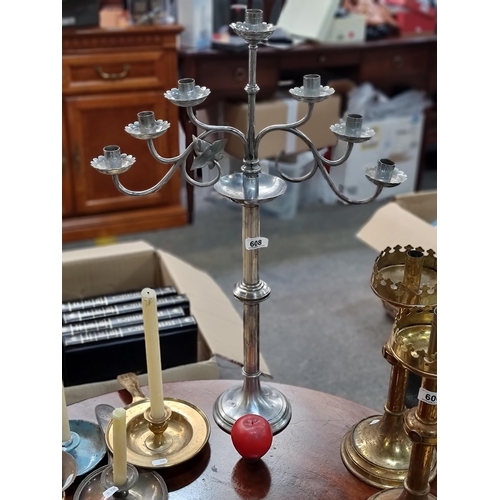 608 - A beautiful tall vintage silver toned candelabra with two branches off the central stem, holding spa... 