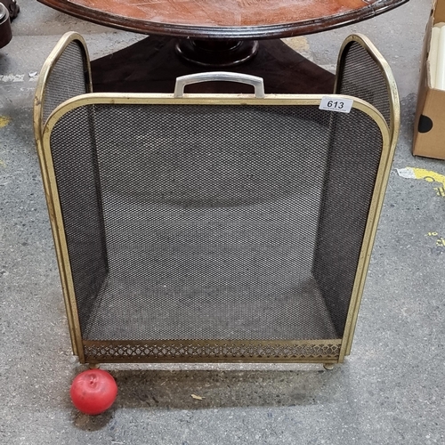 613 - A smart vintage  fold out fire screen with lovely pierced brass bass and curved edges.