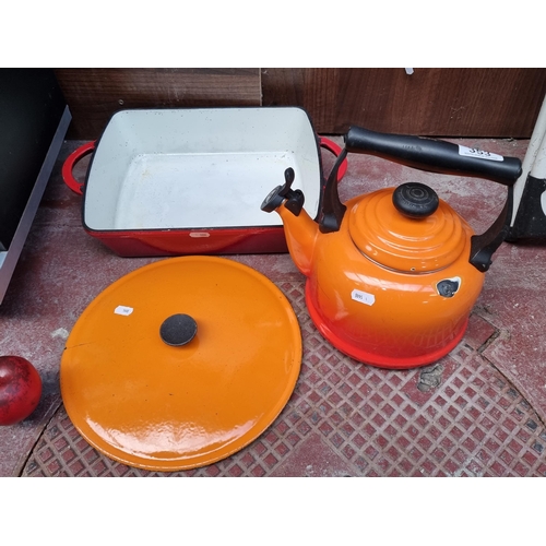 353 - 3 cast iron enameled kitchen ware items including a Le Creuset stove top kettle, a pre 1957 Cousance... 