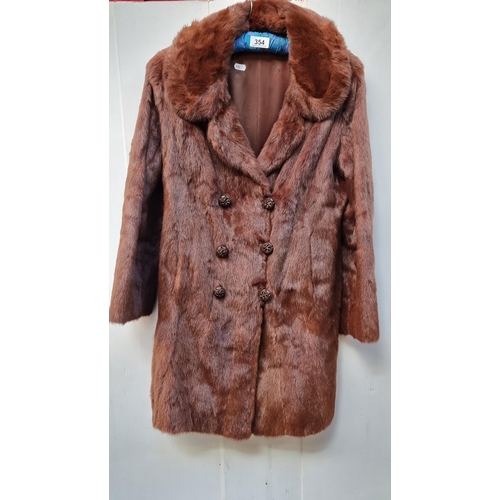 354 - A stunning 1960's fur coat with super soft feel and double breasted fastening. Featuring embroidered... 