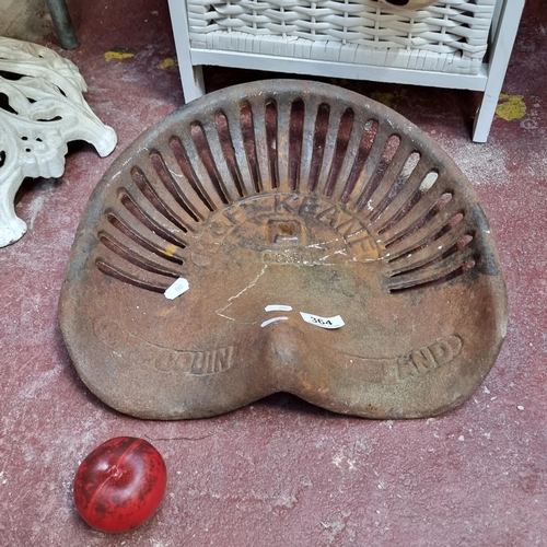 364 - A cast iron R&F Keane Cappoquin Ireland tractor seat.