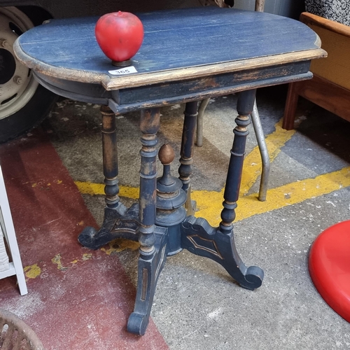 365 - An ornate vintage side table with profusely turned supports. In a navy and gilt finish. H63cm