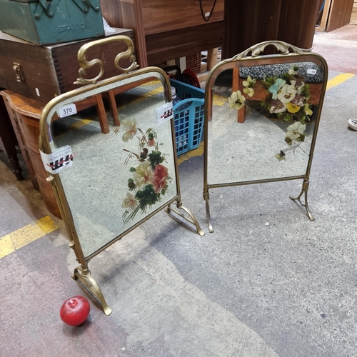 370 - Two charming Art Nouveau mirrored fire screens boasting hand painted floral designs. Held in elegant... 