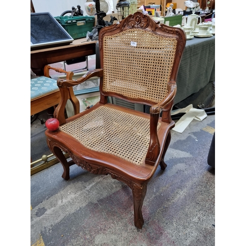 391 - A beautiful large Regency style caned occasional chair with unusually wide seat as well as elaborate... 