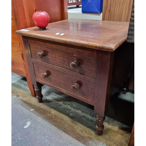 401 - An antique mahogany commode with lid to reveal a red chamber pot. Features false drawers and turned ... 