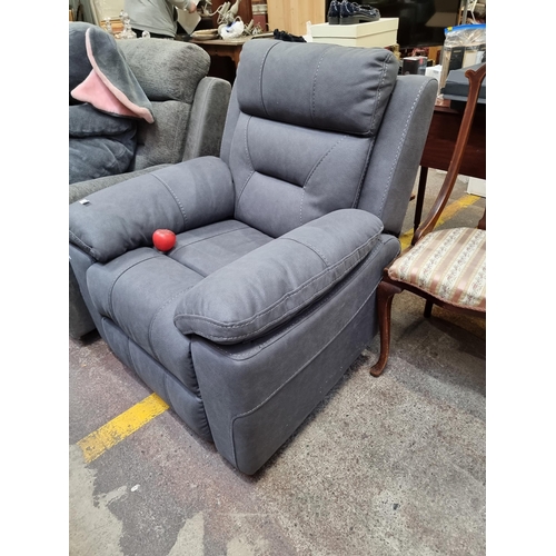 409 - Star Lot : A stylish excellent recliner armchair in a charcoal grey leather finish. €1800 less than ... 