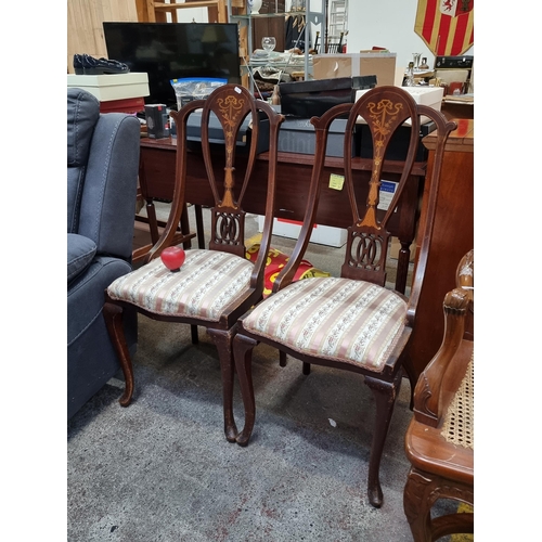 410 - A gorgeous pair of Edwardian occasional chairs featuring highly ornate backrests with marquetry and ... 