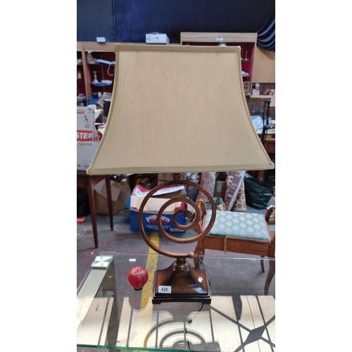 426 - A gorgeous and extremely stylish abstract metal bronze toned table lamp with swirl motif detail and ... 