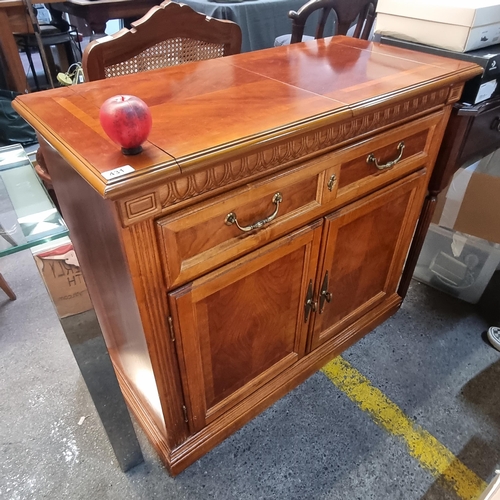 431 - Star Lot : A solid well made home bar with large pull out top, two drawer and two additional cupboar... 