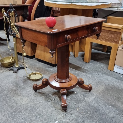 710 - Star Lot : A lovely Victorian table with a drawer and a pillar base held on four legs with ceramic c... 