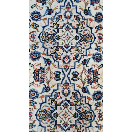 728 - Star Lot : A lovely hand knotted wool hall runner rug in shades of cream and baby blue. L298cm x W96... 