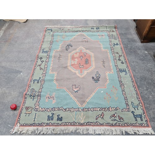 729 - Star lot : An unusual hand knotted wool rug from Kashan. Featuring a figural and anamorphic design i... 