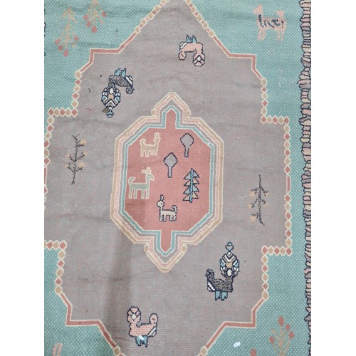 729 - Star lot : An unusual hand knotted wool rug from Kashan. Featuring a figural and anamorphic design i... 