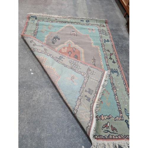 729 - Star lot : An unusual hand knotted wool rug from Kashan. Featuring a figural and anamorphic design i... 