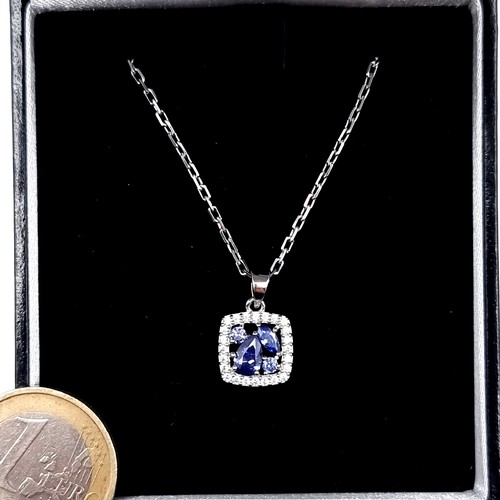 596 - A sterling silver tazanite stone pendant set on a bright cut sterling silver chain, length 46cm, old... 