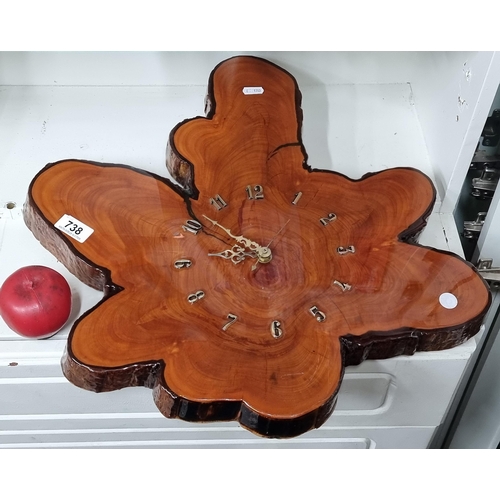 738 - An organic shaped American hand made tree ring wall clock. Nice this all hanecarved and varnished.