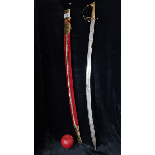 751 - A highly impressive brass ceremonial dress sword with red velvet scabbard and steel blade.