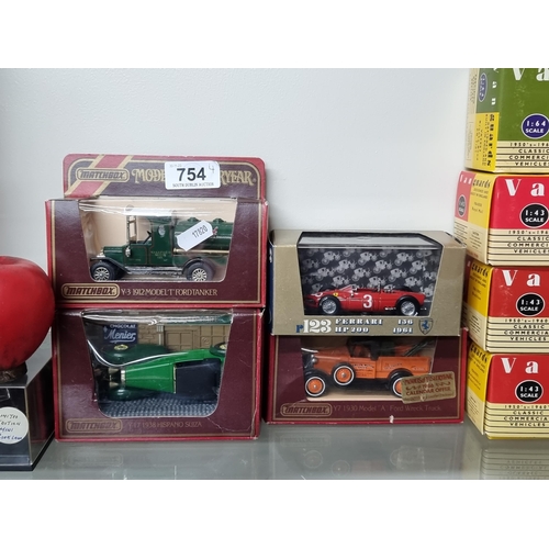 754 - A collection of four vintage model toy cars including three Matchbox examples.