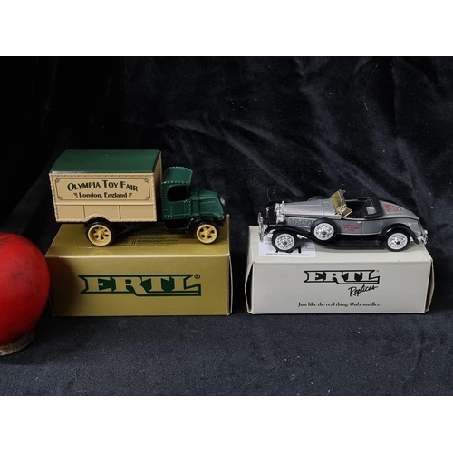 761 - Two retro boxed Ertl model toy cars.